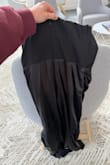 The zipper doesn't work right. Tried it on only a few times. Got frustrated and now returning. The zipper has no damage. IT WILL NOT ZIPPER WHERE THE 2 DIFFERENT MATERIALS MEET IN THE BACK. - Chelsea D.