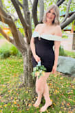I got this for my daughter's senior homecoming. It was a different style than she's worn in the past, and she got lots of positive feedback. The fabric in the body of the dress has some stretch, so it's flattering and comfortable. And the white off-the-shoulder detail was cute and gave some extra coverage.
My daughter is tall, so it's sometimes hard to find a mini dress that isn't too "mini". Paired with foundation garment undershorts in black, she did not have to worry about the length at all. - Amanda S.