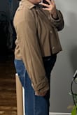 I was on the hunt for a cute fall, cropped trench coat. This item seemed like a good option because of the image. However, the fabric is simply polyester and thin. It would not serve the trench coat purpose as it is built for aesthetics rather than functionality. So, if you're looking for functionality, this is not for you. - Angelica T.