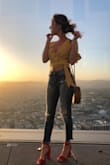 I love this top. The color is perfect, and the style is adorable. I received many compliments wearing this. I did not wear a bra, I do recommend fashion tape. 

Overall, an adorable fun flirty top that I can't wait to wear again. - Virginia W.