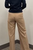 I bought these for work and they fit well, and are comfortable. I typically wear a 0 or XS and I'd like these to be a bit more fitted at the waist and hips. Fabric is light, wouldn't be good for winter in the northeast but fine for rest of the year. Fabric also doesn't give me confidence they'll last long. The top clasp fell off within the first hour of wearing them, it was just loosely sewn in place. I'll fix it and still wear them but wanted more out of these for the process. - Abbie M.