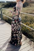 I've never been complimented more on a dress than when I wore this. Perfect for the black-tie optional wedding I attended. I average a large in Lulus dresses. The fit of this dress was almost perfect, I just needed some tape to keep from showing too much side boob lol. I am a 36DD and it wasn't too tight at all. I just needed help with the loops on the buttons on the neck. - Caitlyn G.