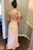 This dress is exactly what I imagined! It fits very true to size and I was surprised at how I didn't really need a bra with it even though I am a DD! You can however wear a strapless bra and nothing shows. I love the lace top and the flowy skirt. - Cara M.