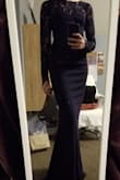 I love the dress! It is a little snug but I would not go down a size. It looks great on and for the most part easy to move around in. The material is light and NOT see-through! - Jacey K.