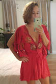 Make sure you know your Free People size! There are long slits all the way up the arms. Its very 'flowy' so windy days are out. It is extremely short. It is a dress not a romper. I haven't figured out which shoes to pair this with, maybe a boho sandal. I haven't worn this out yet either, it is extremely low and requires fashion tape. Seems like I may be too petite to pull this off. My butt lifts the back end up also to make it shorter than the front so be careful if you're curvy. - Rebecca T.