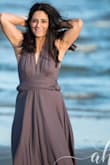 The material on this dress was perfect for the photo shoot we did on the beach! It was light enough to move very well in the wind, and heavy enough to stay put on my body. 
It is long for a shorter girl, but for my purposes it was perfect.
Easy to manipulate to style how I wanted.
The fit was great! I have wider hips, and it was a little snug going over but once it was o it looked and felt very comfortable. 
Great buy for me, because I can use this again and again! Loved it! - Morgan C.