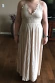 It's a linen-like fabric and not as flowy and long as some of the other Lulu dresses. The back of the dress is awesome! However, the front needs some work. The scalloped pieces in the front just flip forward and the waist band under the top is pretty tight. If you size up for the waist band then the chest area would be too big.
The dress I purchased also had a strap flaw where the adjustable strap was sewn in upsidedown on one side. Pretty obvious.
Would be an ok vacation or summer dress, but it's not dressy enough for a beach wedding bridesmaid dress. - Ashley D.