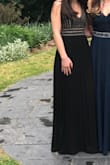 The dress is beautiful! The chest area was a little big, but with a push-up bra it was filled out! The straps are adjustable which is also a plus, the top of the dress has all gold embellishments, and the skirt is pleated. The only downside was how long it was, I had like a foot of extra fabric, which was easily hemmed though. Highly recommend this dress! - Anna S.