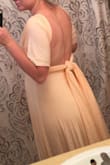 I ordered this dress for my cousin's wedding and it's super comfortable and it fits true to size even with a pregnant belly. The only thing is it does not have great chest support for women with bigger breasts. Other than that it's a great dress and being able to change the top is a bonus! - Moriah D.