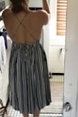 I like this dress but I wish I had ordered a size down. It was my first time ordering from Lulus and I didn't want anything to be too tight so I got a large but I think a medium would have been more flattering. The materiel is really nice. I'll just need some fashion tape in the boob area. Otherwise a nice dress and the colors are flattering (picture doesn't do it justice). - Sarah M.