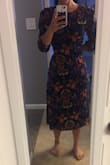 I really love this dress but I definitely should have ordered a small. After reading a bunch of reviews that it's tighter around the chest area, I decided to go with a medium, but it is swimming on me! I considered returning it for a small but I think the small may even be too big. I am going to get it altered but in the meantime, belting it works just fine! Wore it the other day and loved it! First pic is dress naturally falling on me, second pic is me pulling the extra material of the dress back to see how it'd look in a smaller, more fitted size. - Jerrica S.