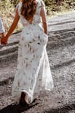 I wore this dress for my engagement photos. I absolutely love this dress. It's elegant & unique. I did have to get it hemmed by a tailor though, because even with 2.5 inch heels it was too long. I can't wait to wear it again! - Alexis S.