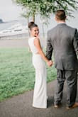 I got married in this dress on the beach in Bar Harbor, Maine! It was perfect for what I was looking for. I didn't want to spend a lot of money and I didn't want a heavy wedding dress, but was still able to achieve that timeless classy look. I added a crystal belt for a little sparkle which finished the look for our private ceremony. It was very long so I had to have it hemmed (story of my life!), but otherwise it fit perfectly. It was extremely comfortable and hugged the right spots and it bunched up in the most flattering way. - Kayla S.
