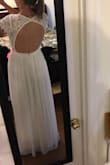 I am wearing this for my wedding on June 23rd! It is beautiful and the fabric is so soft. It runs long but I am tall and will wear heels so it's perfect.  It is a little tight in the waist and will show cleavage if you have a bigger chest.

It is very well-made and I am very happy with it. - Hannah G.