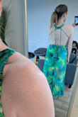 Beautiful fabric and I love the high cut on this. It does fit a bit awkwardly around the bust/waist though and isn't very fitted. It sort of buldges out around the bust if you cinch the waist too much. (Or doesn't lay flat against the waist uncinched)

The length just hits the ground (I'm 5'9") - Leah M.