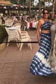 My waist /stomach are my LEAST favorite parts of my body , so to show my mid-drift is not anything I'd ever considered as an option before . Plus I'm not a young 20's something. I figured I'd take a chance on this outfit for a girls trip to Mexico.  There in the humid tropical weather, where everyone wears beach attire,  I could be daring and wear something out I would never feel comfortable wearing at home .  
 Well, not only did I feel sexy, I had multiple women from young to older out of no wear coming up to me at the buffet outdoor dinner, asking me where I'd bought my dress and how great it looked on me. I felt young ,stylish, trendy but classy.....not like I'd gone too over the top for my age (43, bty). The dress is high waisted....so hides lower tummy....and the top, cinched tightly, went to about my last rib.  I have a very long torso, however.

Cons of this outfit: no way can you wear a bra. Even a backless strapless bra shows.  If you have boobs that don't need support, all is good as nips aren't obvious, but this top can't be worn with anything other than boob sticker bras....a joke if you have 32DDD like me. Best to embrace slight sagging and go with it. The top does get loser as you move around, but it's an adjustable tie top with string ties in the back so I wasn't surprised. All in all, it's a winner. - Christine H.