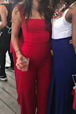 I have this pantsuit in black too. I think it's sexy while still classy - I wore this to a networking mixer. You really stand out in the red color! Get it!! - Darrin N.