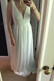 I bought this as a potential wedding dress for my elopement. The dress was beautiful and could lean toward boho, which is what I wanted. But the bust wasn't right for me. Specifically because I have nothing to fill it in! And I didn't love it enough to have it altered. Still giving it 5 stars though for being a good quality dress with a unique neckline. - KRISTIN L.