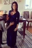 I bought this in blue for my baby shower and although a little snug up top, it was flowy enough to breathe in. I have it in Black in an XS and it fit perfectly before and after baby. It's super low cut but still looks cute if you wear a bandeau top under it for a more modest look. (The blonde pic is the black dress with a black bandeau under it). - Cristina M.