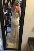 This dress is sooo pretty and I love the small train, looks so elegant. It is very fitted from the top down to your thigh area. The top portion and waist fit perfectly. I purchased this with a handful of other dresses as a possible elopement gown and it lost to another dress, but seriously so beautiful and you can't beat the price! - Olivia M.