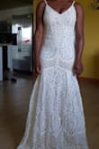 I tried this dress on for my destination wedding. It is a beautiful dress, especially the lace train in the back. Ended up returning it because the color wasn't exactly what we wanted, but would highly recommend - Renata J.