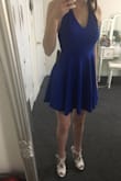 I got this dress despite reviews saying it runs large and I'm glad that I did! It fits me perfectly and there is no looseness anywhere, not even the top. I can wear this with or without a strapless bra, since the back is just high enough to cover the band, or even sticky cups (I'm wearing a strapless bra in the pics). I'm usually size x-small, but occasionally wear a small. Glad I went with x-small, or the small would have been too large. I would recommend anyone thinking of getting this dress who is in between sizes to definitely go smaller. It will be perfect to wear this to my graduation ceremony. - Kyla L.