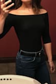 I love this top: it's tight and stays in place. The neck is wide but doesn't go below the shoulders, which makes it versatile in my opinion. I've worn this to work and also out to dinner with my boyfriend. It looks great tucked into a pair of pants/shorts or a skirt! The fabric is very stretchy and breathable as well. - Brittany D.