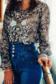 Works better with high waisted jeans/skirts if you don't want belly button to show. Looks really good and makes an outfit look put together. Personally liked styling it tucked in. Loved it!!! Always makes simple look classier. - Yelena T.