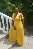 This dress is so beautiful! I received so many compliments on it and it fit perfectly. I have a lot of breast and it covered them well. It totally worked for the wedding that I went to. At times I had to re-tighten the knot for where it was tied, but other than that the dress was perfect. - Shaunette A.