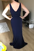 I bought this dress for my bridesmaid in navy and the medium fits her perfectly! The length is perfect with heels. It's form fitting yet very flattering. I would definitely purchase it for myself in other colors for fancy events! - Jennifer P.