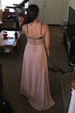 The front of the dress is a little plain but the back is so cute!! The straps were a little tight but once I had someone adjust them the fit was just right. - Lisa M.