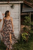 Beautiful dress. The snap comes undone easy but I sewed it and that was an easy fix. Adjustable straps. Plenty of length, I wore it with wedges. - Jessica G.
