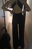 I love this jumpsuit! I was worried it wasn't going to fit because I needed length but also have a lean figure. I got a small so it would be form fitting and was worried the small would be too short. It fits perfectly! There is enough length in the legs and I can even wear a 2' heel with it! The top half fits my body snug but doesn't feel restricting. I will not need to wear a bra under this because of the fit but someone with a larger chest might have a harder time. I ordered this for an event and I am even more excited for the event now that I have this jumpsuit! The price is great and I want it in more colors! - Anna B.