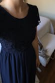 I fell in love with the back of this dress- sooo cute. But as someone mentioned in an earlier review, the lace was more crochet than the dainty, thinner lace I was expecting. The scoop neck didn't look great on me, it made me look like a grandma in the front, but a party in the back! - Katie K.