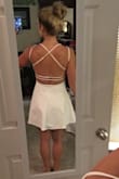 I absolutely adore this dress. It fits perfectly and the back straps aren't loose or too tight. The slip underneath is a little snug, but I think it helps it to stay in place. Love the neckline, not too revealing but still super sexy. - Danielle S.