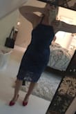 Love this dress. I ordered it for my son's wedding rehearsal dinner. I normally take an 8 but I felt that it was too short and a bit too tight to the point where if I put a strapless bra underneath it would be too tight. I went up to a large and it's perfect it gave me an extra maybe 3 inches in length as before when I bent down you could see my underwear. Good quality fabric gorgeous color I'm going to order one in the champagne color too. The back wasn't tied in the photo, I couldn't do it myself so it looks a bit loose. But you get the idea. - Lisa W.
