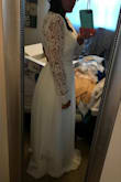 I loved this dress as a contender for my fall wedding dress, however the sleeves weren't quite fitted to my arms and I just felt frumpy in it. I think it looked OK but just didn't feel right to me. I ordered a L. - Leslie B.