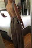 My friend is getting married and gave us a list of dresses to choose from for bridesmaid dresses. I ordered this and another one. I was afraid the material of this dress would look cheap beside the other more "chiffon" styles but I was so wrong. The material has a slight shine to it and looks beautiful beside other fabrics. Also it is SO comfortable!! And incredibly flattering. I love how the fabric hangs and how you can wear it different ways. It fits great, I'll just need a couple inches hemmed off the bottom. My only complaint would be that I wish it came with an instruction card for how to do all the different looks. - Alyssa H.