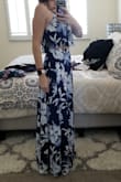 I did not size up and it's perfect, just a bit long. You can adjust the straps on the top to show more or less midriff. Would need to be hemmed as it's too long even with 4" heels. - Mandy M.