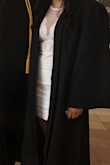 I was a little scared not knowing if the dress was going to fit, it came in the day before my graduation. But it was perfect, the length was good, it fit just right wasn't too tight. Only issue I had was the sleeves were a little too long. They would fall down or create a gap between my shoulder and sleeves. Other than that the dress was absolutely perfect. The lace mesh also wasn't revealing at all. It was a very elegant dress. It's kinda hidden behind my gown but you can see a lot of it. - Natalie B.