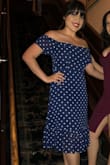 This dress is beautiful and has a romantic feel to it. It hugs all the right places for a form-fitting look. It fit my bust just right without making anything else look baggy. Got tons of compliments! - Elizabeth G.