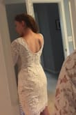 After not being able to find a lace shirt for my wedding dress separates, I was excited to find this dress! I was worried the back would show my bra because it's so low, but it doesn't. It's flattering and good quality. The sleeves and shoulder area are a little loose but I'll get it tailored. I'm planning wear this with a maxi tulle skirt. - Sarah S.