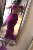I love this dress so much. The color is beautiful. It fits like a glove. Shows off all your curves and flatters your body. It's a little long but that's probably because I'm so short lol. The best part is the open back, which gives you a little bit of that sexy feel. So excited and cannot wait to wear this to a wedding in a few months. - Marissa A.