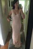 I was SO pleasantly surprised with the way this dress fit! I'm in a wedding in September, and after trying quite a few looks, I was not having any luck. I have a wide waist (i.e. athletic build, no hourglass here), so sizing is always a challenge -- I'll be a small in bust and hips, but a LARGE in the waist sometimes! I was nervous about this fit, guessing that it would either fit well on the top & bottom, but be way too small in the waist or vice versa, with a fitted waist and too big on the top & bottom. This dress is stretchy enough to hug my body in ways that actually makes it look like it HAS curves (y'all...this is exciting). I have to get it hemmed, but that's almost a give-in with long Lulus dresses, and it's 1000% worth it. I got this in pink as a bridesmaid, but I'd get it in white if I were the bride! - Renee H.