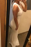 The material was such good quality! It was the perfect combination of stretchy but tight enough to hold everything in without showing every bad thing. I have a bigger belly so I could have worn spandex, but I definitely wouldn't have sized up because I'm so short, the back was a little too long. I returned/exchanged to get a different dress that fit my wedding style more, but this dress was amazing! - Taylor J.