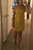 Such a nice dress, wore it on my birthday and I received compliments all night. It has a straight fit which makes it flattering but it is not tight fitting on the hips (it a-lines slightly) like a bandage dress so it's not tacky or too clubby at all. You can definitely dress it up or down. Other reviews mentioned you can wear a bra with this dress... unless you want to look trashy or poorly put together, this is false!! You can absolutely see a strapless bra at the back of this dress when you tie the fabric together. I went bra-less and since it's a high neck I felt totally comfortable! The fabric isn't too thin and the color is as pictured. Highly recommend - Samantha D.