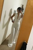 I've been eyeing this jumpsuit for a few months and finally bought it with the intention of wearing it to my bachelorette party. I love how hot the back looks and figured the plunge neckline would be fine on my small chest - still a bit sexy without being crazy.
The XS was a bit too tight on me even though that's my usual size for Lulus. I felt like the crotch was riding up a lot.
I sized up to a S and that was way too loose.
I really wanted to make this work with the XS - it looked okay but just felt really tight in the crotch area - I would spend a lot of time pulling it down. Very sad to send it back! - Cary