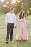 I have REALLY large boobs (36G) but I usually can get a medium in anything. This dress fit me every where but my chest. It actually fit very awkward in that area, it was loose at the V and I ended up having to safety pin it for my engagement photos which sucked. But she photoshopped! And it ended up looking ok! I would get a large if you're super busty like me and just take it in anywhere else needed... 
But I don't think this dress is meant for girls with bigger boobs! I wish I would have looked for a different one. - Layney S.