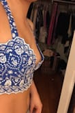I do have to agree with the other reviewer. This top just doesn't fit as well as I thought it would. I don't feel like there is much support for bigger chested girls but there is also too much space for smaller chested girls. It's like a weird fit. I'm taking these photos with the back crossed which is supposed to cover it up even more, and it's still pretty loose. When I bend down there's a huge gap in the middle. - Janalys