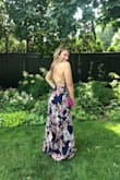 Love love love this dress!! Wore it to a wedding and then out afterwards and got tons of compliments. The tie back is so sexy and easy to manuever on. I have a big chest but it fit perfect and they didn't hang out or feel pushed down or anything. Must buy! - Meghan P.